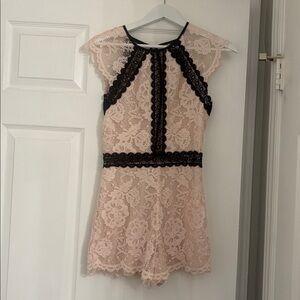 Bebe Pink Lace romper with Black Accents